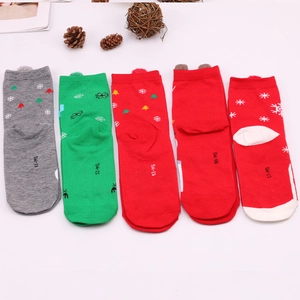Cozy autumn women's Christmas socks set with Santa and reindeer patterns in festive colors