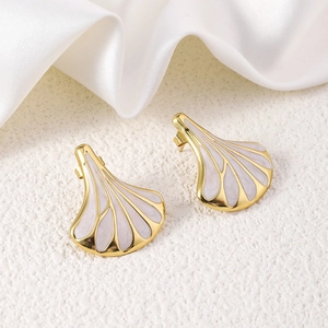 Macro detail of gold-plated fan-shaped earrings with lavender enamel on white silk