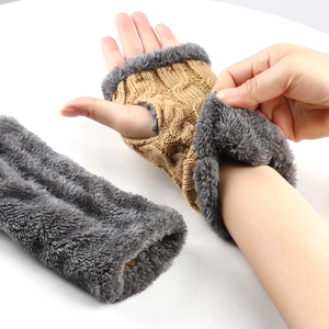 Chunky beige cable knit fingerless gloves with thick grey faux fur lining and thumb holes