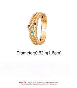 Detail of multi-layer gold ring with red and blue zircon stones and sizing info