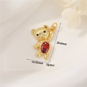 Detailed view of bear pendant with red zircon showing 20.6mm height and 14.92mm width