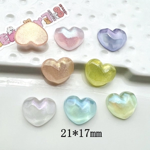 Macro shot of 21x17mm heart-shaped iridescent resin charms for DIY jewelry and phone cases