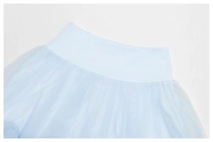 Detail of light blue tiered tulle tutu skirt featuring a wide elastic waistband
