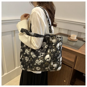 Skull floral print tote bag detail showing large capacity and practical front pocket