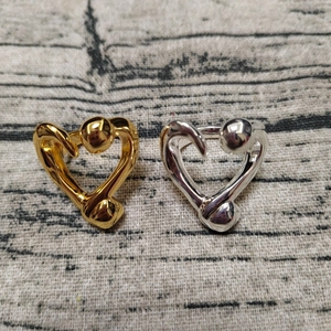 Polished gold and silver heart-shaped nail rings with minimalist open-ended design
