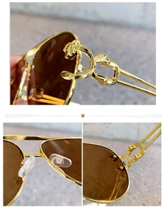 Detailed close-up of golden metal hinges and silicone nose pads on leopard sun glasses