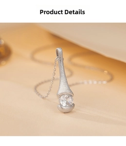 Detail of 925 silver pendant showing brushed matte texture and sparkling round zircon