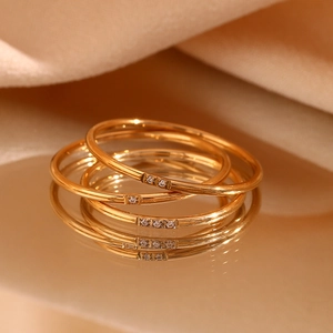 Three stackable 18K gold plated stainless steel rings with micro-pave crystals
