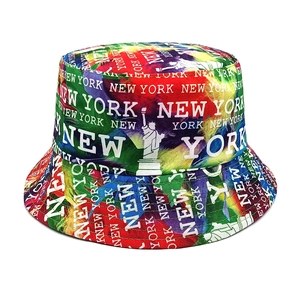 Detail of colorful graffiti fisherman hat featuring New York print and statue motifs