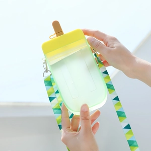 Creative green popsicle-shaped water bottle with yellow lid and adjustable patterned strap