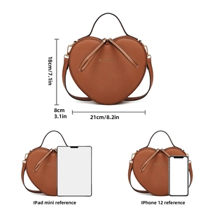 Detailed size comparison of heart-shaped crossbody bag in caramel brown with measurements