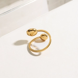 Macro shot of 18K gold plated stainless steel open ring with dual bead minimalist design
