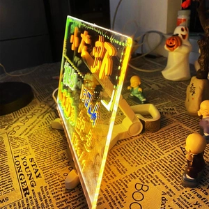 Detail of LED acrylic writing board with adjustable white stand and glowing neon text