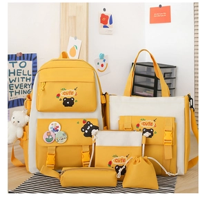 Detailed set of 5 nylon school bags for students including backpack and tote in yellow and white