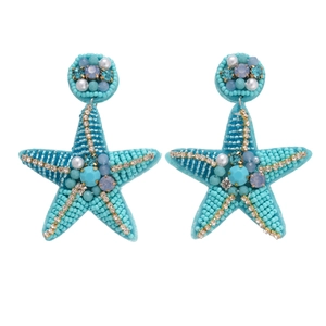 Starfish beaded earrings with turquoise beads and sparkling rhinestones on white backdrop