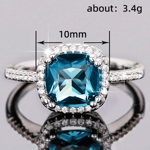 Retro royal style blue square gemstone ring with halo diamonds weighing 3.4g