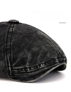 Macro detail of washed denim beret featuring distressed texture and reinforced stitching