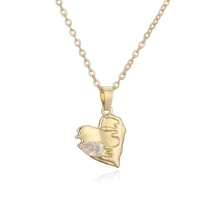 Gold heart pendant necklace with lava metal texture and teardrop zircon on white background
