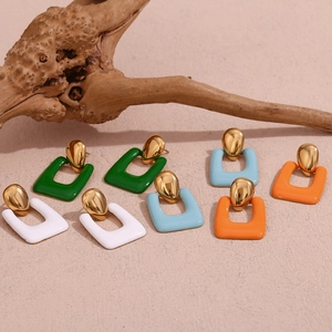 Detail of 18K gold plated geometric earrings in white, green, blue and orange enamel