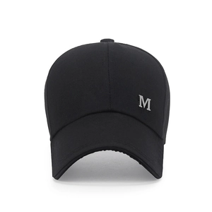 Classic black baseball cap with extended brim and metallic M logo on white background