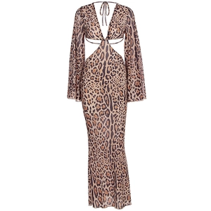 Detail of leopard print maxi dress featuring waist cut-outs and a deep V-neckline