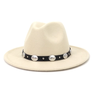 Detail of cream wool fedora hat featuring black belt with silver embossed metal medallions