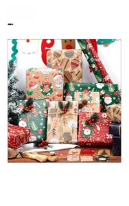 Close-up of Christmas wrapping paper set with Santa patterns, tags and twine strings