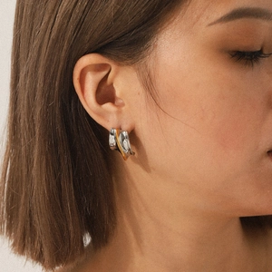 Minimalist two-tone 18K gold and silver stainless steel earrings with crinkled design