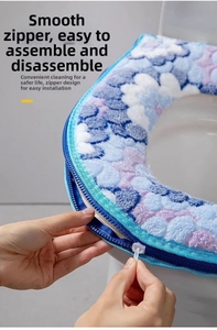 Close-up of plush blue floral toilet seat cover with smooth zipper for easy removal