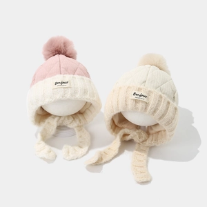 Winter kids' color-block beanie with faux fur pom-poms and earflaps for extra warmth