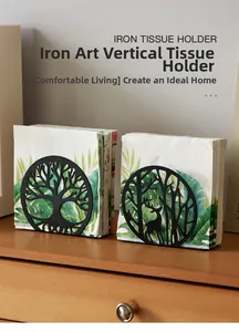 Macro detail of the matte black iron tree pattern on a vertical metal tissue holder stand