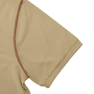 Detailed close-up of khaki polo shirt knit texture with contrasting brown stitching details