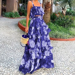 Women's dark blue floral two-piece set featuring a ruffled crop top and maxi skirt