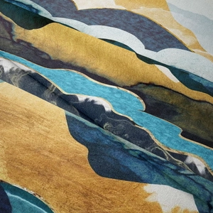 Close-up of fine woven texture and abstract wave pattern on mountain tapestry