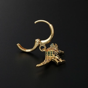 Gold triceratops hoop earrings with colorful pavé cubic zirconia on black background