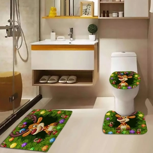 Detailed view of 3-piece Christmas bathroom set with green reindeer motif and anti-slip mat