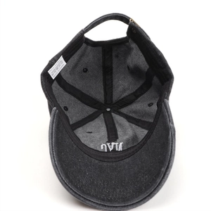 Detail view of cotton denim baseball cap inner structure with adjustable metal buckle