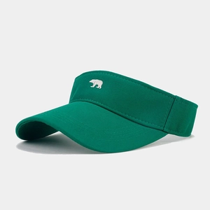 Detailed view of dark green sun visor with white bear embroidery and twill cotton fabric