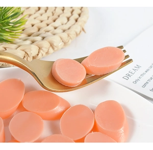 Macro view of realistic PVC miniature sausage slices with detailed texture on a plate