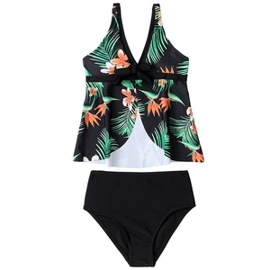 Two-piece girls' tankini swimsuit with tropical floral print and black high-waisted bottom