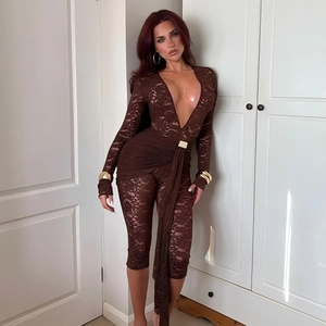Detail of deep brown lace bodysuit with plunging V-neckline and metallic waist accents