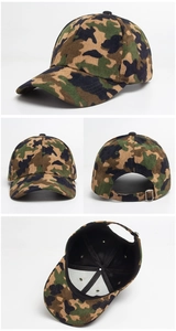 Detail view of camouflage corduroy baseball cap with metal buckle and curved brim