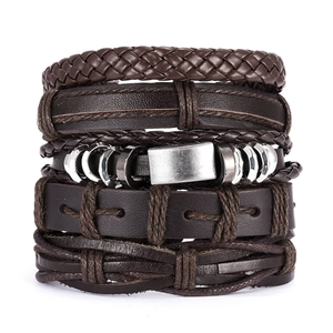 Detail of five-piece dark brown braided leather and metal bracelet set for men