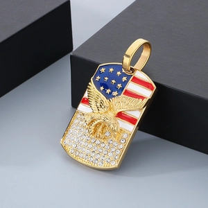 Detailed shot of gold eagle pendant with US flag enamel and cubic zirconia stones