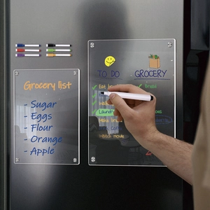 Close-up of magnetic acrylic weekly calendar board for fridge with colorful markers