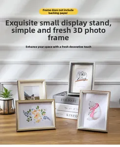 Nordic minimalist photo frames in wood and white colors displayed on a desk