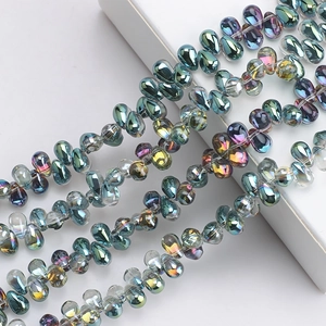 Macro shot of colorful iridescent 6x9mm teardrop glass beads for DIY jewelry making