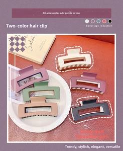 Detail view of large matte rectangular hair claws in Morandi two-tone拼接 color design