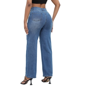 Rear view of mid-blue high-waisted flared jeans with distressed denim texture and pockets