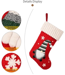 Detailed view of knitted Christmas stocking with gnome applique and snowflake patterns
